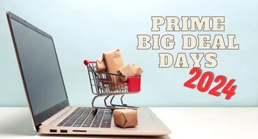 Laptop und Einkaufswagen teasern die Amazon Prime Big Deal Days im Oktober an